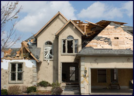 house with wind damage