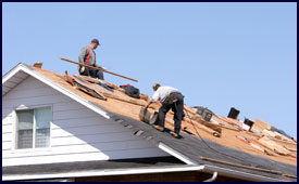 workers fixing a roof