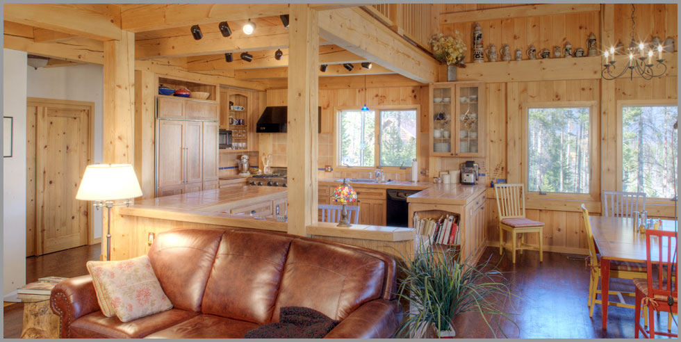 green building with a timber frame home